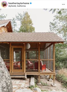 a small wooden cabin sitting on top of a rocky hillside