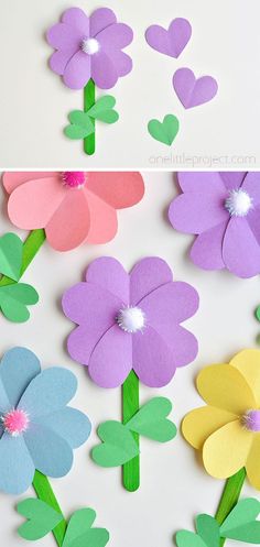 paper flowers with hearts on them are cut out to look like they have been placed together