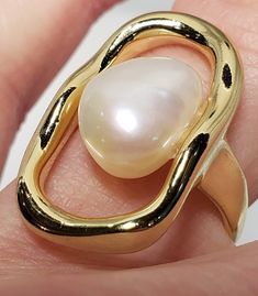 925 Sterling silver gold-plated ring with freshwater pearl.  Materials: Sterling silver, freshwater pearl Size of the ring: US 5  Width of the shank: 2,3 mm Open Pearl Ring, Gold Plated Rings, Pearl Size, Rings Statement, Freshwater Pearls, Statement Rings, The Ring, Silver Gold, Jewelry Rings