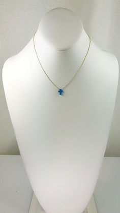 Description Simple. Chic. Minimalist™ A perfectly dainty brilliant synthetic fiery blue opal cross is floating freely on a delicate feminine 14k gold plated over Sterling silver chain. This cute and tiny star charm necklace features a synthetic created blue opal moon stone with sterling silver chain. This lovely star necklace is perfect for complementing a casual outfit, and you can even layerbit with other necklace to create something unique. * High Quality 925 Sterling Silver link chain with s Cheap Blue Charm Necklace With Round Pendant, Dainty Star Of David Jewelry With Adjustable Chain, Delicate Blue Birthstone Jewelry, Blue Birthstone Dainty Jewelry, Dainty Blue Birthstone Jewelry, Blue Dainty Birthstone Jewelry, Adjustable Blue Jewelry With Delicate Chain, Blue Dainty 14k Gold-filled Jewelry, Dainty Blue 14k Gold-filled Jewelry