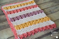 a crocheted dishcloth on a wooden table