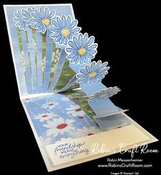 an open card with blue flowers on it