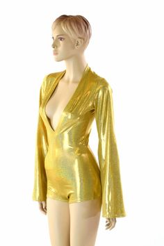 "This item is made to order, please read all the way through the listing before purchasing! This bodysuit is made of a gold metallic holographic sparkly jewel spandex. Long Bell cut sleeves and boy cut legs. This fabric has an amazing holographic sparkle! Deep, plunging v neckline. Four way stretch for a figure forming fit. This bodysuit is unlined. Womens Sizing (See below for instructions on where measurements should be taken) XXS: Bust 29\"-30\" / Waist 22\"-23\" / Hips 30\"-32\" Extra Small: Disco Metallic Bodysuit For Club, Glamorous Metallic Bodysuit For Night Out, Metallic Disco Bodysuit For Party, Metallic Long Sleeve Bodysuit For Party, Gold Fitted Bodysuit For Club, Gold Long Sleeve Bodysuit For Night Out, Metallic Shimmer Fitted Bodysuit, Metallic Long-sleeve Bodysuit For Party, Yellow Fitted V-neck Bodysuit