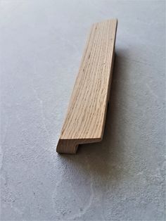 a close up of a wooden object on a floor with no one around it or in the background