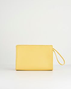 Like a little ray of sunshine, shining on your outfit, this wristlet pouch from our Meadow Creatures collection with its expertly crafted design comes in vibrant Sundress Yellow. Adding an instant pop of colour to any summer outfit, it’s a perfectly practical sized bag for all your everyday essentials. The chic, wrist handle allows hands free freedom, whilst Fable’s signature bee in gold-tone hardware adds a contemporary luxe finish.
  Key features:
  Approx. 19 (L) x 13 (H) x 6 (D) cm
 Outer: 1 Contemporary Luxe, Swan Jewelry, Luxury Christmas Gifts, Wristlet Pouch, Ray Of Sunshine, Bottega Veneta Shoulder Bag, Louis Vuitton Shoulder Bag, S Signature, Short Necklace