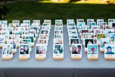 a table topped with lots of pictures and cards