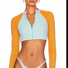 Maaji Lark Reversible Long Sleeve Rash Guard Bikini Swim Top Color Is Golden Hour Measurements (In.) : Approximate (Flat Lay) Chest - 12.5 Shoulders - 12.25 Sleeves - 24 Length - 12.5 D-4 Fitted Blue Rash Guard For Spring, Spring Beachwear Rash Guard For Pool, Spring Stretch Rash Guard For Pool, Casual Fitted Color Block Swimwear, Fitted Summer Rash Guard In Athleisure Style, Fitted Rash Guard For Spring Water Sports, Spring Poolside Rash Guard For Beachwear, Fitted Tops For Water Sports In Summer, Athleisure Swimwear With Upf 50+ For Spring