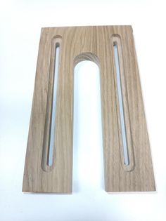 a pair of wooden handles on a white surface