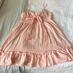 Never Worn And Totally Adorable. Can Be Worn With Heels Or Flats And Even With A Jean Jacket Over Top. Tie Can Be In Front Or In Back. Pink Casual Mini Dress With Ruffled Straps, Casual Mini Dress With Ruffled Straps For Daywear, Spaghetti Strap Cotton Mini Dress With Ruffle Hem, Sleeveless Ruffled Dress For Loungewear, Sleeveless Ruffled Loungewear Dress, Feminine Cotton Sundress With Ruffled Straps, Spring Tie Back Casual Dress, Spring Casual Tie-back Dress, Spaghetti Strap Sundress With Ruffles For Daywear