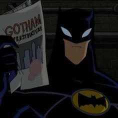 batman reading the newspaper while holding his fist up