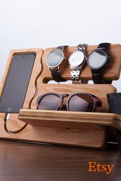 three pairs of sunglasses in a wooden case