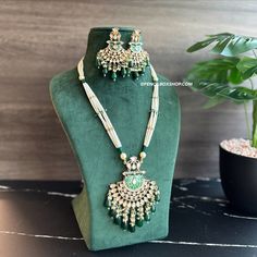 22k gold plated Green Enamel meena work Pearl Long Tayani Necklace set. Experience elegance and tradition with our 22k gold plated Green Enamel meena work Pearl Long Tayani Necklace set. The intricate meena work adds a touch of luxury, while the long tayani design exudes sophistication. Elevate any outfit with the timeless beauty of pearl and gold. American Diamond Necklaces, Oxidized Necklace, Polki Necklace, Western Earrings, Ethnic Necklaces, Ethnic Earrings, Kundan Necklaces, American Diamond, Green Enamel