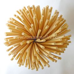 a bunch of wooden sticks arranged in the shape of a ball