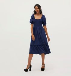 Meet the Louisa Nap Dress®. The Louisa Nap Dress® includes elasticated smocking, a scooped neckline, ruffle hem midi skirt and flexible puff sleeves.The 2022 Louisa Nap Dress® features a fixed neckline and midi skirt. If you love Louisa, check out the updated fit featuring a flexible, elasticated neckline and lengthened midi skirt. Laura Dresses, Sabrina Dress, Nap Dress, Daphne Dress, House Dresses, Hill House, Navy Midi Dress, Lilac Dress, House On A Hill