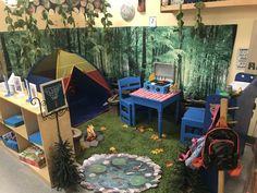 the children's playroom is set up with toys and tent, bookshelves