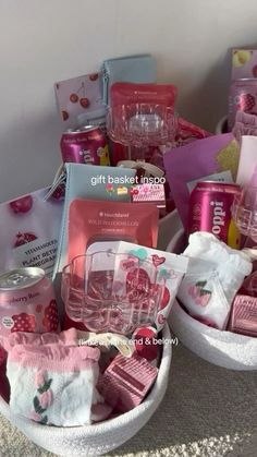 two baskets filled with pink items on top of a table