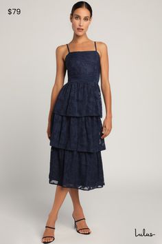 Catch their glance when you're strolling in the Lulus Grace and Beauty Navy Blue Burnout Floral Print Tiered Dress! Woven fabric, with a burnout floral jacquard design throughout, shapes this dress with adjustable spaghetti straps and a straight neckline. A darted bodice (with smocking at the back for fit) tops a banded waist and a tiered midi skirt. Hidden back zipper/clasp. Fit: This garment fits true to size. Length: Mid-calf length. Size medium measures 39" from adjustable straps to hem. Bus Dress Code Guide, Tiered Midi Skirt, Rehearsal Dinner Dresses, Jacquard Design, Adhesive Bra, Cup Sizes, Straight Neckline, Floral Jacquard, Lulu Dresses