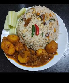 a white plate topped with rice and veggies