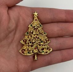 AAI Christmas Tree Brooch Christmas Pin Vintage Christmas Pin Vintage Brooch Vintage Christmas Tree Brooch Gold tone Mid-Century Design Excellent Vintage Condition - Like New in Original Packaging Gold Christmas Brooches For Festive Occasion, Gold Christmas Pins For Gifts, Gold Christmas Gift Pins, Gold Christmas Holiday Brooch, Gold Brooches For Christmas Gift, Christmas Pins, Brooch Vintage, Vintage Christmas Tree, Vintage Brooch