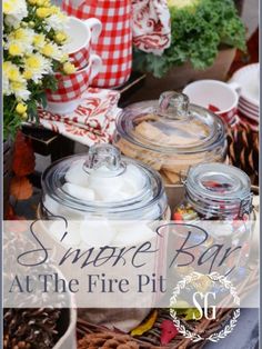 some food is sitting on a table with flowers in the background and text that reads, simple but at the fire pit