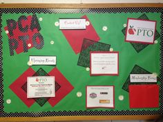 a bulletin board decorated with red, green and black paper work on it's side