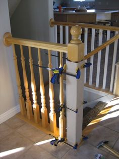 the stairs are being worked on with wood and metal handrails in this house