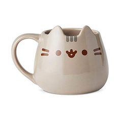 a cat shaped mug is shown on a white background