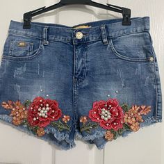 Brand Lc Collection, High Waisted Jean Shorts With Embroidered Red Flowers And Pearls. Size L New Never Use Doesn’t Have A Tag High Waist Embroidered Blue Bottoms, Blue High Waist Embroidered Bottoms, Blue Embroidered High Waist Bottoms, Casual Red Bottoms With Floral Embroidery, Red Denim Shorts For Spring, High-waisted Blue Jean Shorts With Floral Embroidery, Blue High Waist Floral Embroidered Jean Shorts, Blue High-waisted Floral Embroidered Jean Shorts, High Waist Blue Jean Shorts With Floral Embroidery