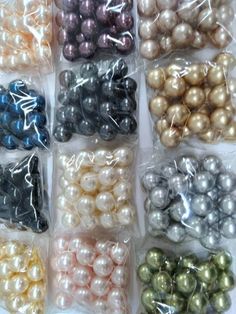 many different colors of pearls in plastic bags