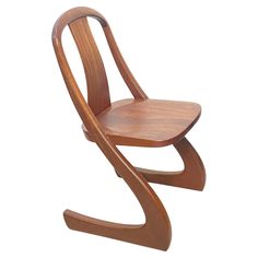 a wooden chair that is bent to the side