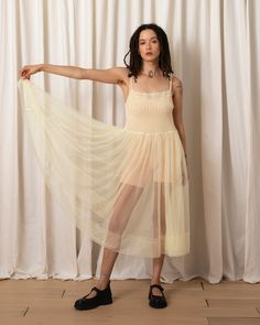 Sheer mesh dress with all over ruched bodice, full midi skirt and adjustable spaghetti strings. CONTENT & CARE:100% Nylon meshDry clean -or- hand wash cold & lay flat to dry MEASUREMENTS:XS - Chest (relaxed): 30", Waist: 31.5", Bottom Hem Opening (flat): 83.75", Front Length (front top of bodice): 39", Strap length (extended, front to back, adjustable): 17"S - Chest (relaxed): 32", Waist: 33.5", Bottom Hem Opening (flat): 84.75", Front Length (front top of bodice): 40", Strap length (extended, f Summer Tulle Dress With Ruched Details, Fitted Mesh Dress With Tulle Skirt, Summer Mesh Dress With Tulle Skirt, Spring Evening Nylon Mesh Dress, Spring Evening Mesh Dress Made Of Nylon, Summer Sheer Tulle Mesh Dress, Sheer Tulle Mesh Dress For Summer, Summer Mesh Midi Dress With Tulle Skirt, Summer Mesh Dress With Tulle Skirt, Midi Length