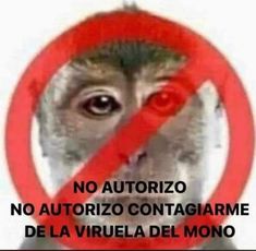 a monkey with a red circle around it's head and eyes in front of a sign that says no monkeys allowed