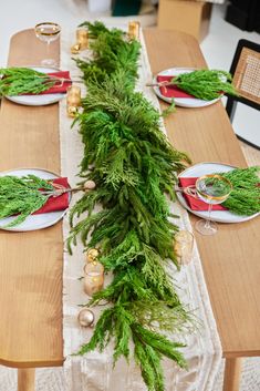 the table is set with plates and place settings