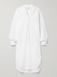 The contemporary cuts of Khaite's designs are part of what makes them so desirable. This 'Seffi' shirt dress is made from white denim for an oversized fit enhanced by dropped shoulder seams and splits along the curved hem. Adjust the snap fastenings at the neckline to create more or less coverage. Modern White Cotton Dress, Oversized White Shirt Dress For Spring, Oversized White Shirt Dress For Fall, Oversized White Cotton Shirt Dress, White Shirt Dress For Daywear In Fall, White Shirt Dress For Fall Daywear, White Fall Shirt Dress For Daywear, White Relaxed Fit Shirt Dress For Work, Jean Trench Coat