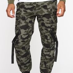 Fashion Nova Men’s Brand Cargo Pants Camouflage Green Zipper Side Pockets/Button Back Pockets Slim Fit Size 34 Jogger Bottom Khaki Military Bottoms, Military Style Khaki Long Pants, Military Style Long Khaki Bottoms, Military Style Long Khaki Pants, Camouflage Utility Cargo Pants With Belt Loops, Military Style Camouflage Cargo Pants, Military Camouflage Bottoms For Streetwear, Combat Style Camouflage Bottoms For Streetwear, Military Style Bottoms With Cargo Pockets