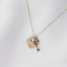 "14K Solid Gold Heart Key Charm and Heart Lock Necklace  The heart key charm is about 13mm x 5mm. It is tiny. The heart lock is flat and it is about 12mm x 10mm. ♡ 14K gold necklace is 0.9mm cable chain It is adjustable to 16\", 17\" or 18\" lengths ♡ 14K gold components" Elegant Heart-shaped Necklace With Two Keys, Heart Shaped Two Keys Necklace For Anniversary, Gold Heart Necklace With Two Keys, Valentine's Day Heart Pendant Jewelry With Two Keys, Key Necklace Aesthetic, R Necklace, Heart Lock Necklace, Gold Jewellery Collection, Deodorant Recipes