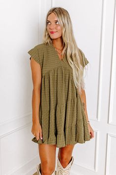 - Twirl into style with this darling dress! - Lightweight material with subtle texture and a soft built-in skirt lining - A v-cut neckline - Short, loose sleeves - A flowy silhouette that ends in a ruffled mini dress length hemline Measurements S : Bust 36", Hip 40", Length 33", Sleeve Length 8.5", Waist 34". M : Bust 38", Hip 42", Length 33", Sleeve Length 9", Waist 36". L : Bust 40", Hip 44", Length 33.5", Sleeve Length 9.5", Waist 38". Martini Olive, Martini Olives, Ruffled Mini Dress, Skirt Lining, Loose Sleeves, Darling Dress, V Cut, V Cuts, Babydoll Dress