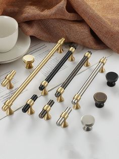 several different types of kitchen handles and knobs on top of a white countertop