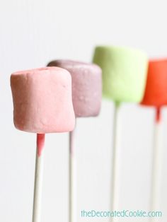 three different colored marshmallows sitting on top of each other