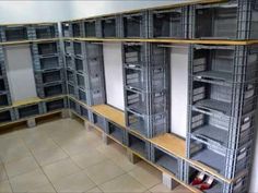 the shelves are filled with many different types of metal containers and shelving unit bins