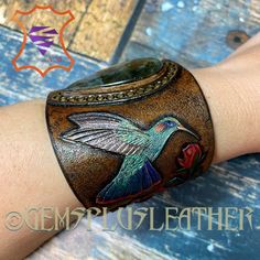 Tooled Leather Hummingbird Bracelet Hand Painted Leather | Etsy One Of A Kind Adjustable Wearable Art Jewelry, Adjustable Vintage Leather Jewelry, Luxury Leather Bangle Jewelry, Vintage Leather Bracelet Jewelry, Handmade Adjustable Luxury Leather Bracelet, Handmade Luxury Leather Bracelet Adjustable, Handmade Luxury Leather Bracelet, Luxury Handmade Adjustable Leather Bracelet, Elegant Hand Painted Bracelet