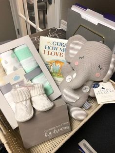 a basket filled with baby items and books