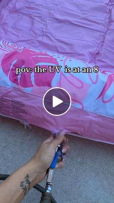 someone is painting the bed with pink and blue paint