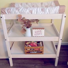 a baby crib with a teddy bear on it