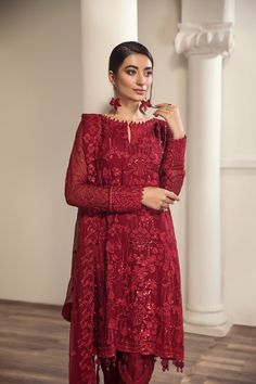 Embroidered Pakistani Salwar Kameez Red Chiffon Salwar Suit is beautifully crafted on a glamorous red shade. This ensemble features classic patterns filled in threadwork of classic patterns in red. Paired with a tonal trouser, the look is complemented by a contrasting-colored pink chiffon dupatta which gives it a charm worth wearing this season. Embroidered Kameez: The kameez has a beautiful red color and it is gracefully emblazoned with intricate designs and embroidery. Floral details and hand- Pakistani Salwar Kameez, Chiffon Collection, Embroidered Chiffon, Red Chiffon, Chiffon Dupatta, Embroidered Neckline, Fashion Consultant, Pakistani Fashion, Clothes Collection