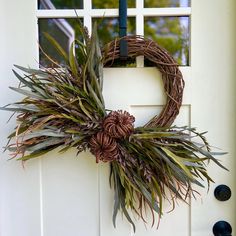 a wreath is hanging on the front door