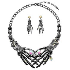 Get into the Halloween mood with our Rhinestone Skull and Bone Necklace and Earrings Set. This edgy yet elegant set features a skull and bone design embellished with sparkling rhinestones, adding a touch of glam to your spooky look. Perfect for making a bold statement at any Halloween event. Skeleton Jewelry, Chunky Choker Necklace, Punk Necklace, Chunky Choker, Halloween Necklace, Hand Necklace, Gothic Skull, Statement Choker Necklace, Halloween Earrings