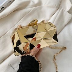 Travel in style with the Yvette Metallic Triangle Cuboid Box Clutch - the perfect accessory for any night out! This fun and fabulous bag comes in three colors, so you can mix and match all your outfits. Perfect for your essentials (and fun extras, too!) and cooler than your average clutch. It's time to shine! SIZE: W17cm x H10cm x D4cm (W6.7" x H3.94" x D1.57") Gender: WOMEN Item Type: Handbags, Shoulder Bags, Box Clutch Main Material: ABS Lining Material: Felt Hardness: HARD Closure Type: Hasp Novelty Bags, Box Clutch, Gold Box, Evening Purse, Chain Crossbody Bag, Mini Handbags, Evening Clutch Bag, Evening Clutch, Small Purse