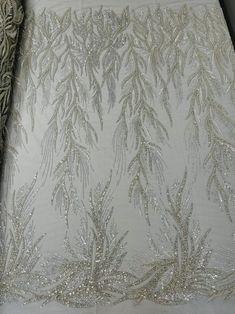 Elegant Embellished Lace For Festive Occasions, Party Lace Embroidered Fabric With Beads, Glamorous Lace Fabric With Intricate Embroidery, Elegant Beaded Lace For Party, Elegant Beaded Lace Embroidered Fabric, Elegant Net Sequin Fabric, Silver Embellished Lace For Party, Elegant Beaded Sequin Fabric For Wedding, Elegant Silver Lace With Sequins