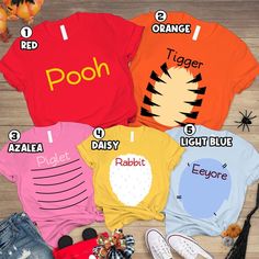 four t - shirts that say pooh, tiger, and daisy